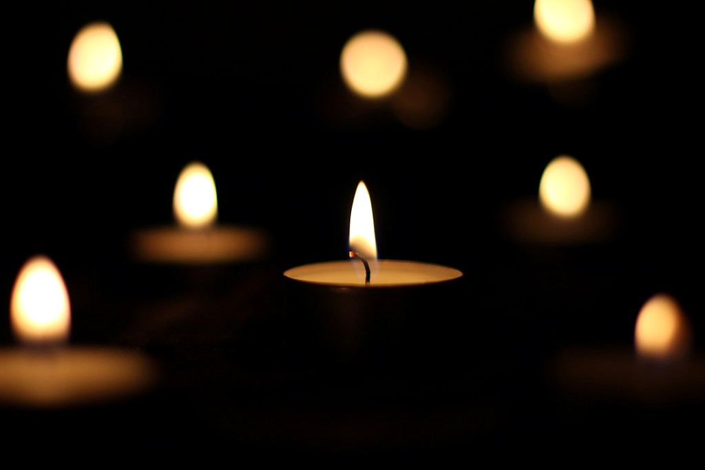 Hand-poured Blissful Redolent candle glowing in the dark